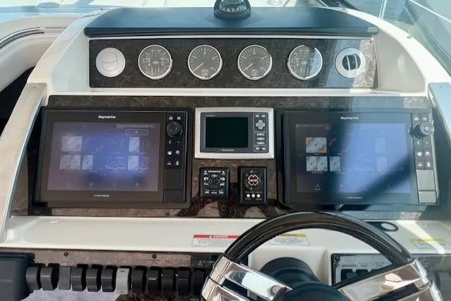 Stay Loose Yacht Photos Pics Dashboard of 2013 Sea Ray 410 Sundancer with navigation screens and controls.