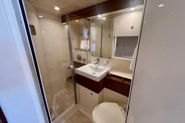 Stay Loose Yacht Photos Pics Luxurious bathroom in 2013 Sea Ray 410 Sundancer yacht with modern fixtures.