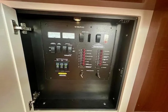 Stay Loose Yacht Photos Pics Electrical panel inside 2013 Sea Ray 410 Sundancer boat, showcasing switches and controls.