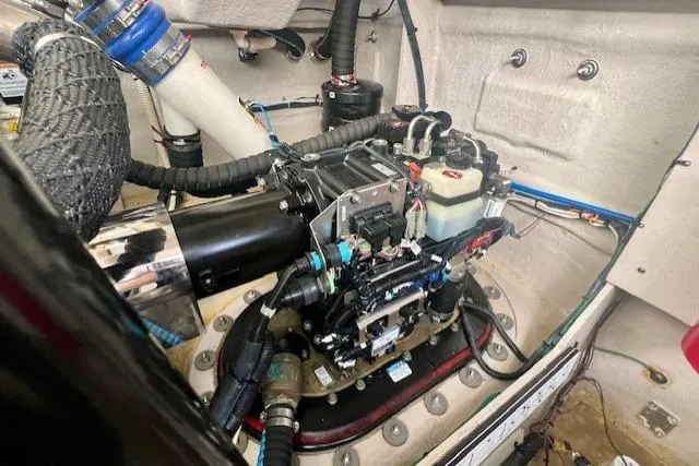 Stay Loose Yacht Photos Pics Engine compartment of a 2013 Sea Ray 410 Sundancer boat, showcasing mechanical components.