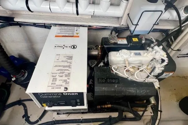 Stay Loose Yacht Photos Pics Engine room of 2013 Sea Ray 410 Sundancer with Cummins Onan generator.