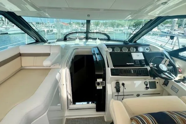 Stay Loose Yacht Photos Pics 2013 Sea Ray 410 Sundancer yacht interior with helm and seating area.