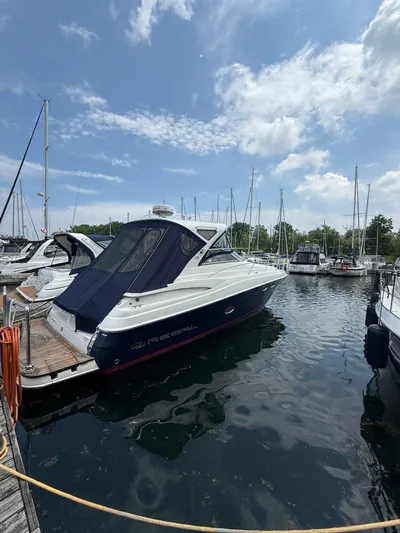  Yacht Photos Pics 2014 Regal 38 Express yacht docked at marina under blue sky.