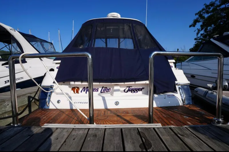  Yacht Photos Pics 2014 Regal 38 Express yacht docked with covered deck and custom name.