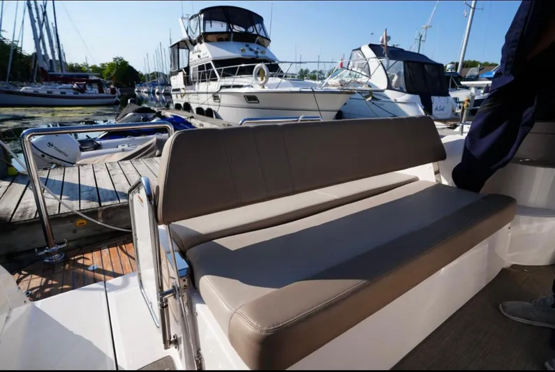  Yacht Photos Pics 2014 Regal 38 Express boat with seating area at marina dock.