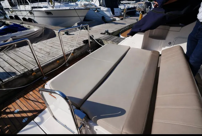  Yacht Photos Pics 2014 Regal 38 Express yacht with beige seating at a marina dock.