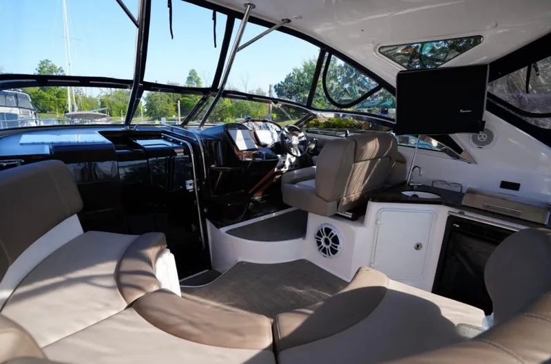  Yacht Photos Pics Interior of 2014 Regal 38 Express yacht with seating, helm, and entertainment system.