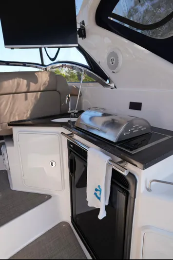  Yacht Photos Pics Outdoor kitchen on 2014 Regal 38 Express yacht with grill and sink.