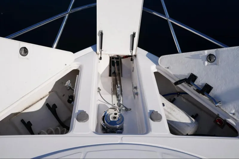  Yacht Photos Pics 2014 Regal 38 Express boat anchor storage compartments open on deck.