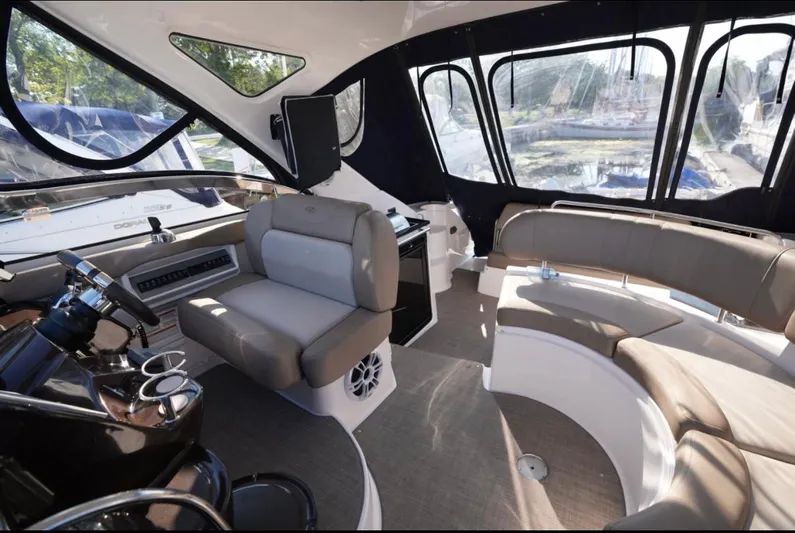  Yacht Photos Pics Interior of 2014 Regal 38 Express yacht with seating and helm station.