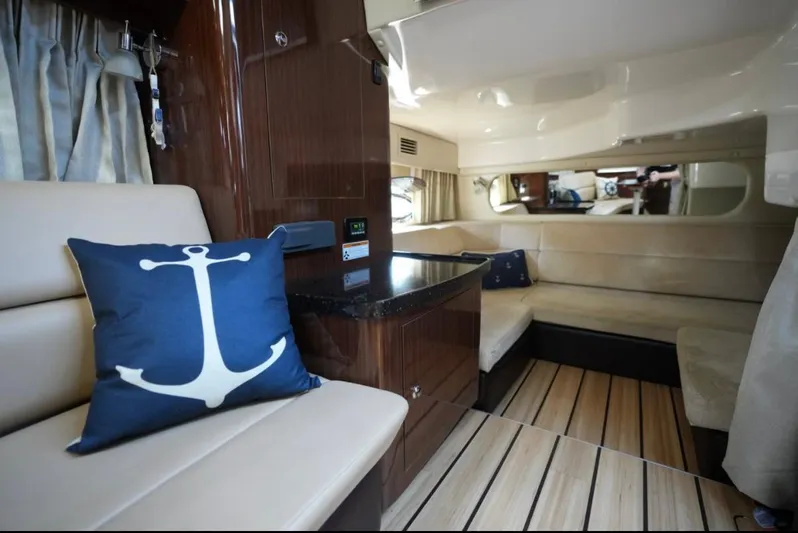  Yacht Photos Pics Luxurious interior of 2014 Regal 38 Express yacht with anchor-themed decor.