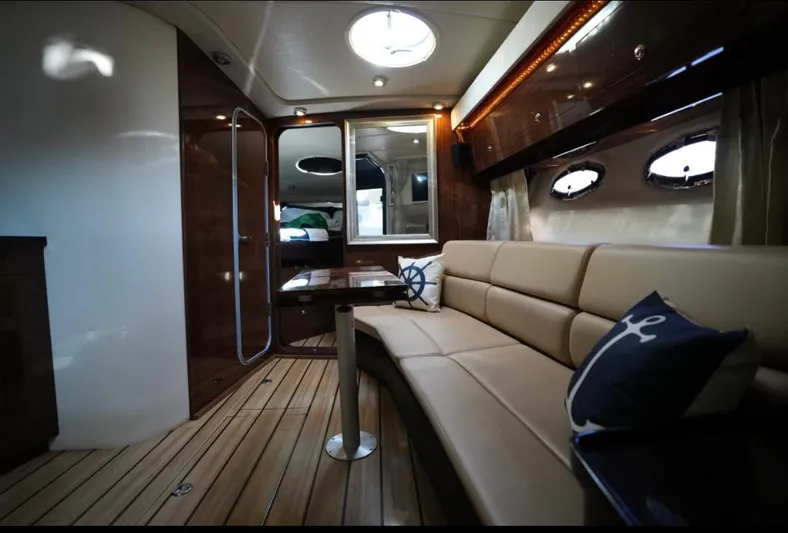  Yacht Photos Pics Luxurious interior of 2014 Regal 38 Express yacht with plush seating and nautical decor.