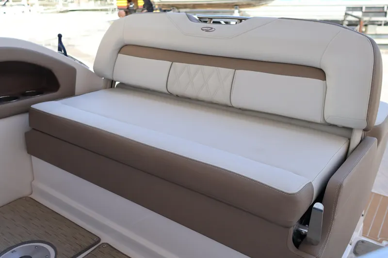  Yacht Photos Pics 2018 Regal 28 Express boat interior seating with beige and white upholstery.