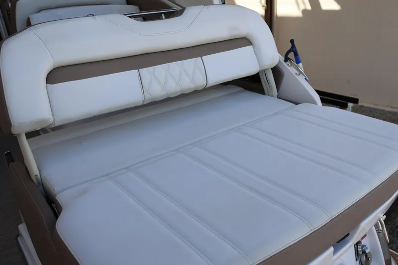  Yacht Photos Pics 2018 Regal 28 Express boat interior with white cushioned seating.