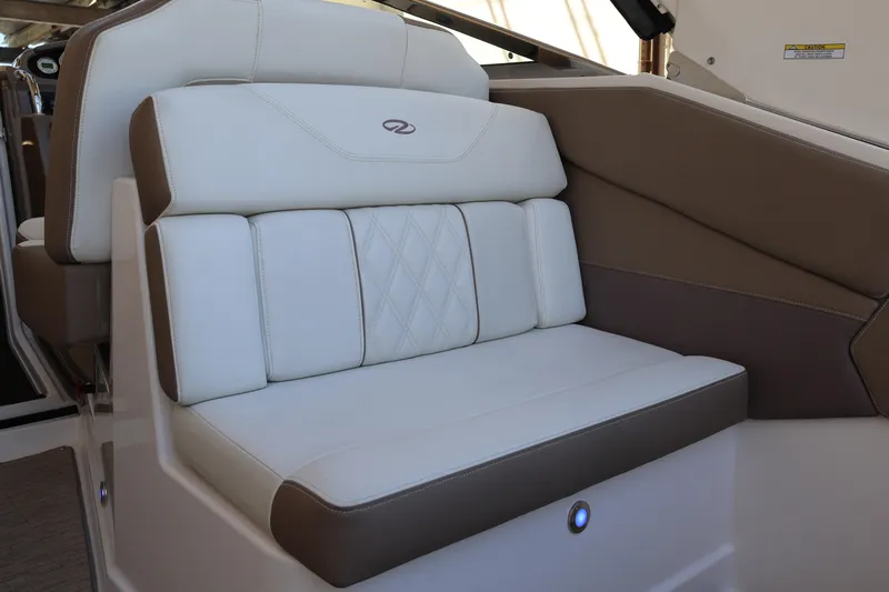  Yacht Photos Pics 2018 Regal 28 Express boat interior with white and brown cushioned seating.