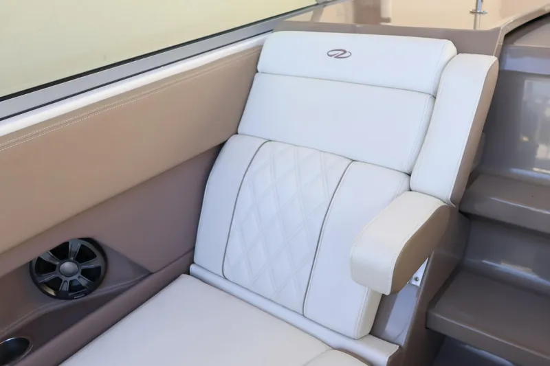  Yacht Photos Pics Luxurious seating on 2018 Regal 28 Express boat with elegant upholstery and speaker.
