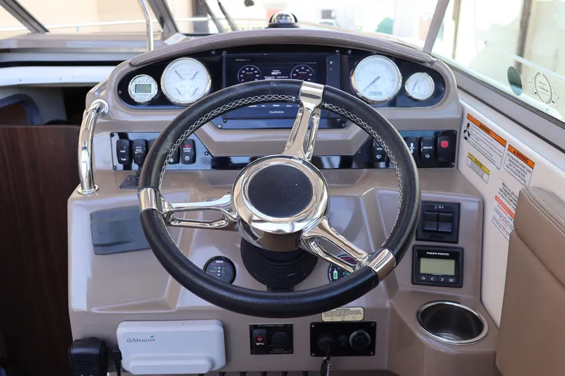  Yacht Photos Pics 2018 Regal 28 Express boat dashboard with steering wheel and gauges.