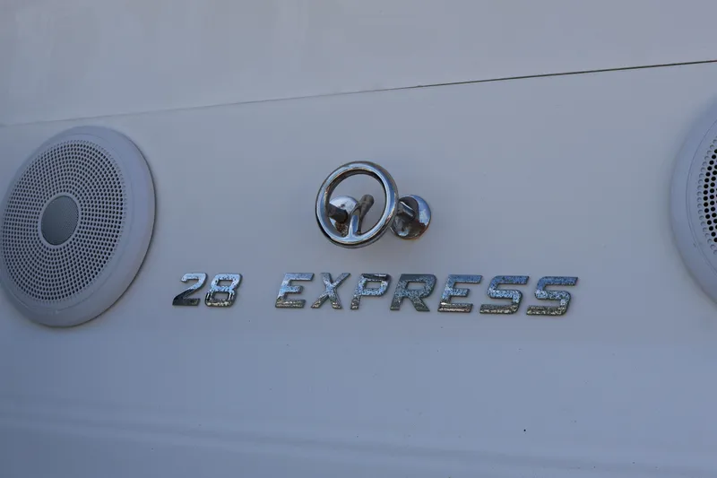  Yacht Photos Pics 2018 Regal 28 Express boat emblem with speakers on white surface.