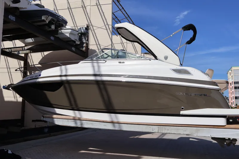  Yacht Photos Pics 2018 Regal 28 Express boat on lift, showcasing sleek design and modern features.