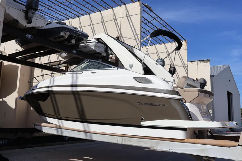  Yacht Photos Pics 2018 Regal 28 Express boat in storage, showcasing sleek design and modern features.