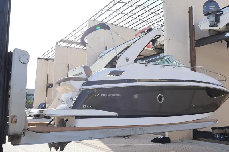  Yacht Photos Pics 2018 Regal 28 Express boat lifted in a marina storage facility.