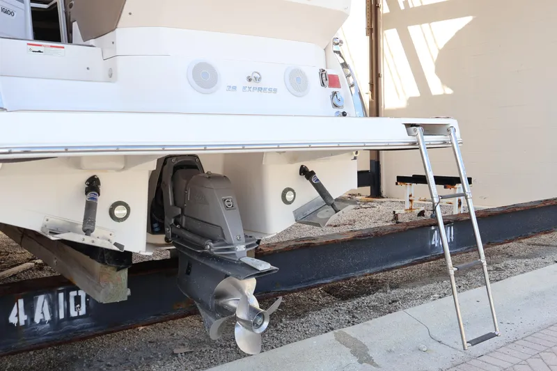  Yacht Photos Pics 2018 Regal 28 Express boat stern with propeller and ladder on display.