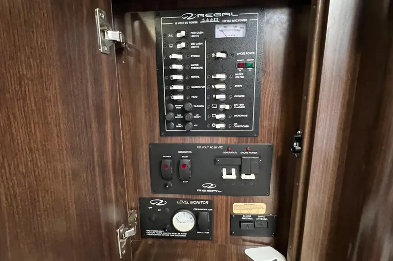  Yacht Photos Pics Control panel of a 2018 Regal 28 Express boat with various switches and indicators.