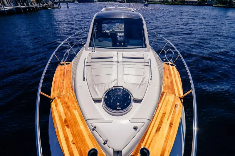  Yacht Photos Pics Evolve 400HT 2021 yacht on water, featuring sleek design and wooden accents.