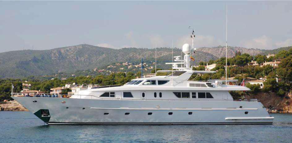 Codecasa 32m 1999 luxury yacht cruising near scenic coastline.