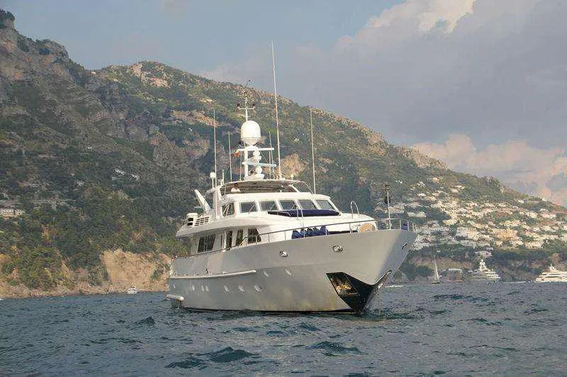  Yacht Photos Pics Codecasa 32m yacht (1999) cruising near scenic coastal cliffs.