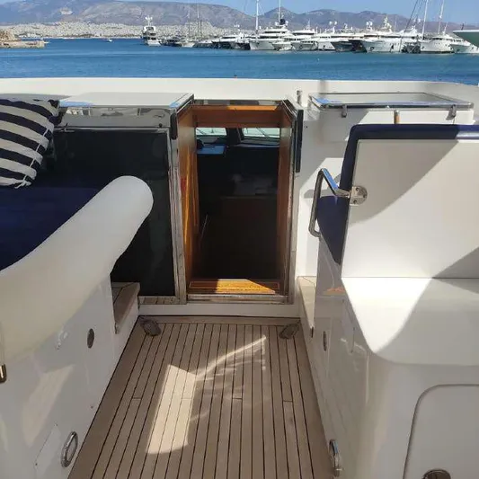  Yacht Photos Pics Codecasa 32m yacht deck with open cabin door, docked in a marina, 1999 model.