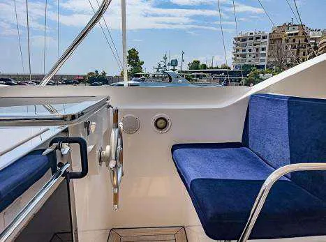  Yacht Photos Pics Codecasa 32m yacht interior, 1999 model, featuring blue seating and marina view.
