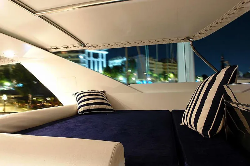  Yacht Photos Pics Luxurious seating area on a 1999 Codecasa 32m yacht with striped cushions.