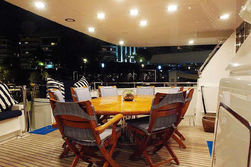  Yacht Photos Pics Luxurious Codecasa 32m yacht deck with elegant dining area, 1999 model.