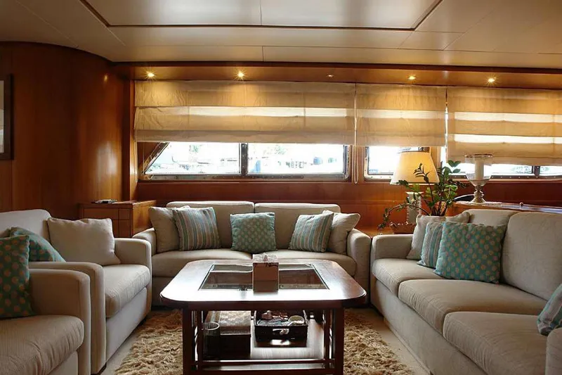  Yacht Photos Pics Luxurious interior of 1999 Codecasa 32m yacht with plush seating and elegant decor.