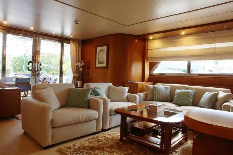  Yacht Photos Pics Luxurious interior of 1999 Codecasa 32m yacht with plush seating and elegant decor.