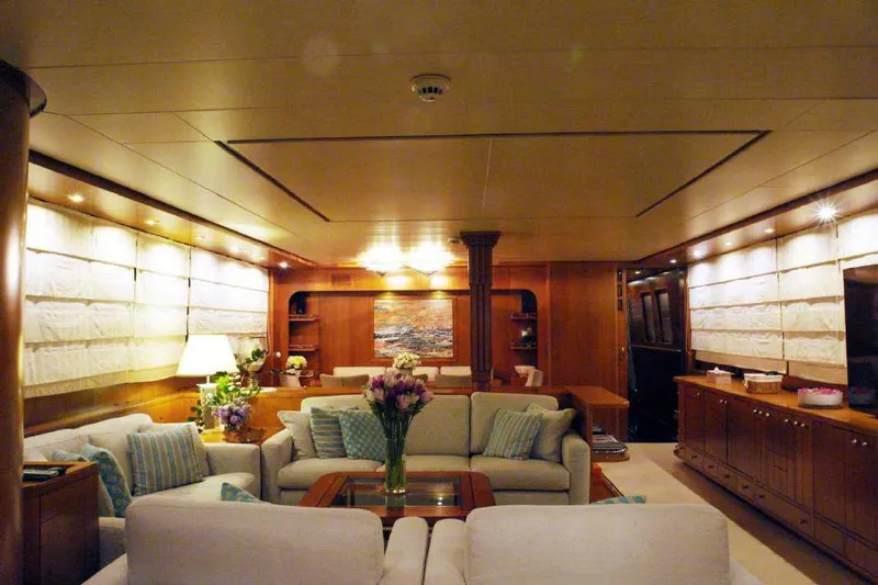  Yacht Photos Pics Luxurious interior of 1999 Codecasa 32m yacht with elegant seating and wooden finishes.