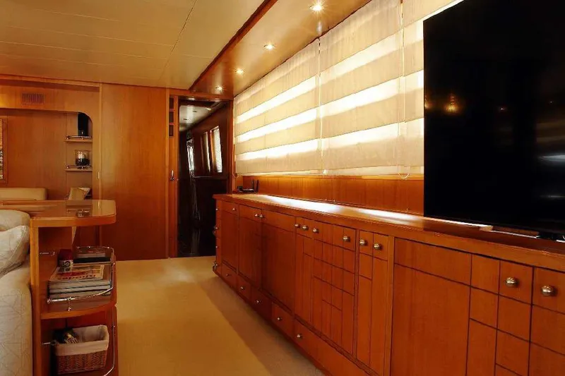  Yacht Photos Pics Luxurious interior of 1999 Codecasa 32m yacht with wooden cabinetry and modern decor.