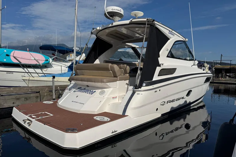  Yacht Photos Pics 2013 Regal 35 Sport Coupe boat docked at marina, featuring sleek design and modern amenities.