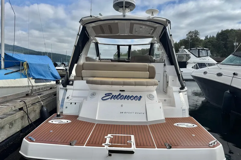  Yacht Photos Pics 2013 Regal 35 Sport Coupe yacht docked, featuring spacious deck and seating area.