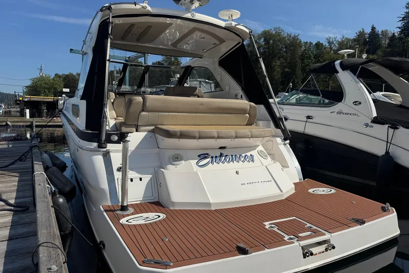  Yacht Photos Pics 2013 Regal 35 Sport Coupe docked, featuring spacious seating and sleek design.