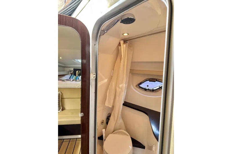  Yacht Photos Pics 2013 Regal 35 Sport Coupe bathroom with shower, curtain, and porthole window.