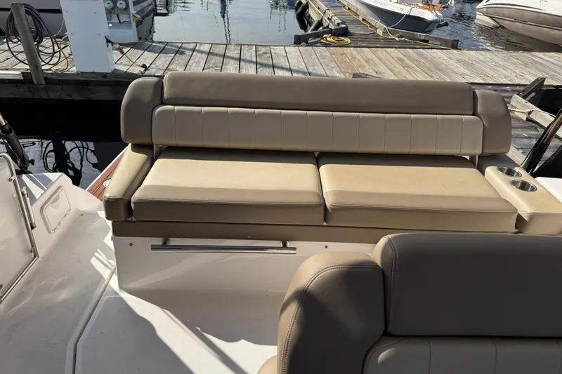  Yacht Photos Pics 2013 Regal 35 Sport Coupe boat seating area at marina dock.