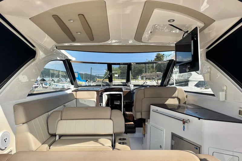  Yacht Photos Pics Interior of 2013 Regal 35 Sport Coupe yacht with seating and entertainment system.