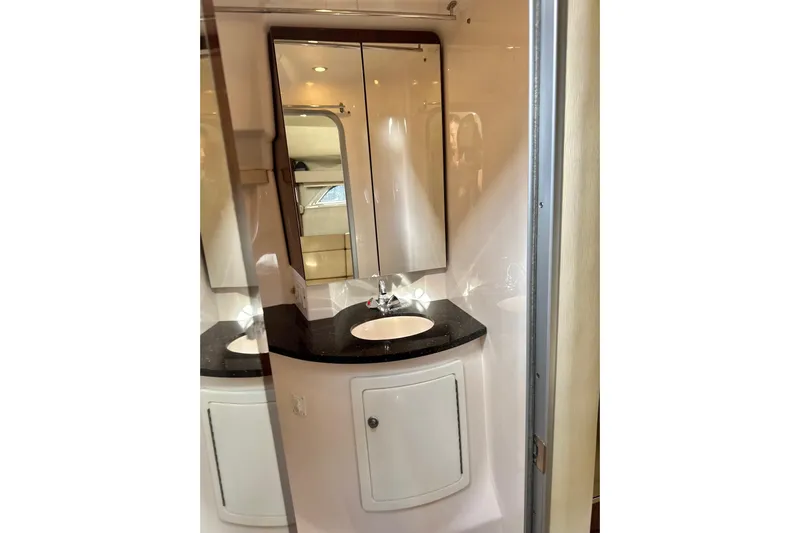  Yacht Photos Pics Bathroom interior of 2013 Regal 35 Sport Coupe with sleek sink and mirror.