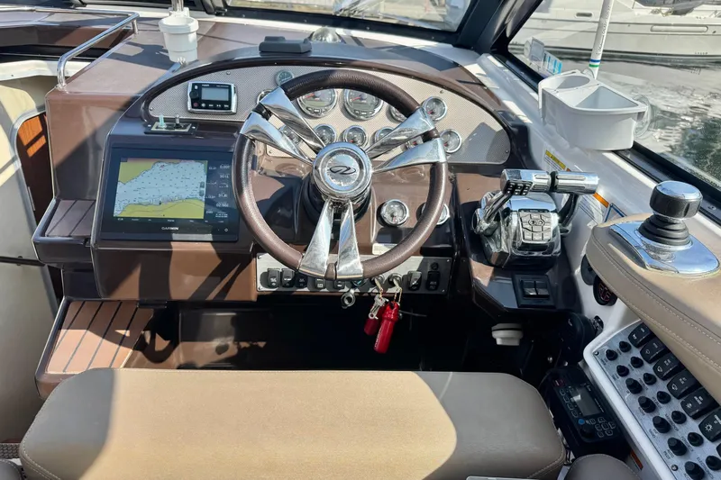  Yacht Photos Pics 2013 Regal 35 Sport Coupe helm with navigation system and controls.