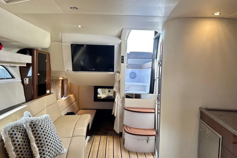  Yacht Photos Pics Interior of 2013 Regal 35 Sport Coupe with modern seating and entertainment system.