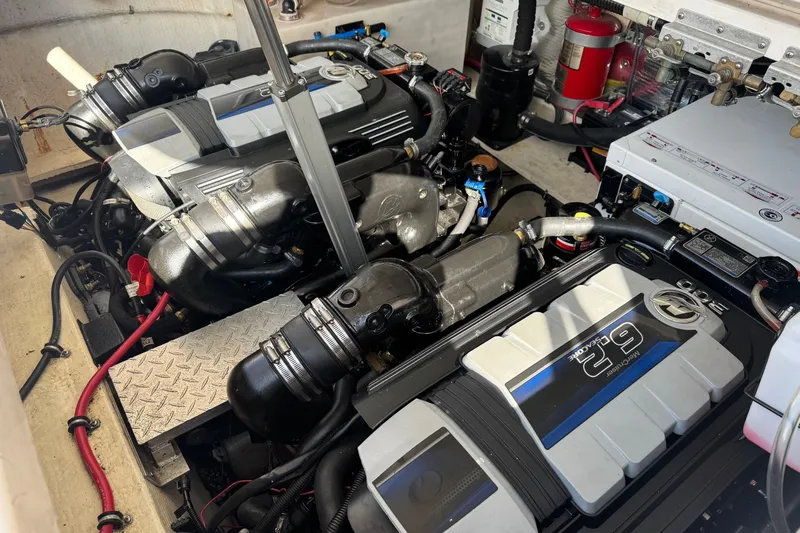  Yacht Photos Pics Engine compartment of a 2013 Regal 35 Sport Coupe, showcasing dual engines and components.