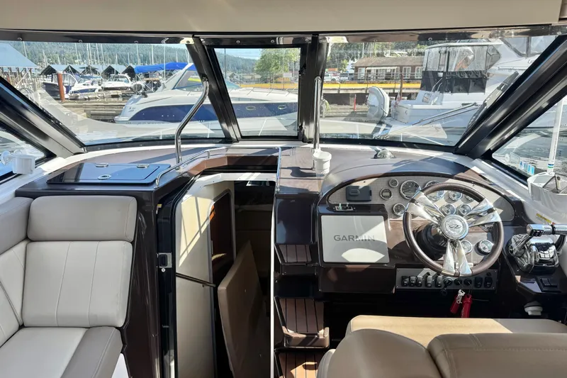  Yacht Photos Pics Interior view of 2013 Regal 35 Sport Coupe yacht cockpit with Garmin navigation system.