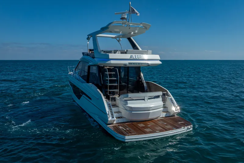  Yacht Photos Pics 2021 Galeon 500 Fly yacht cruising on open sea under clear blue sky.